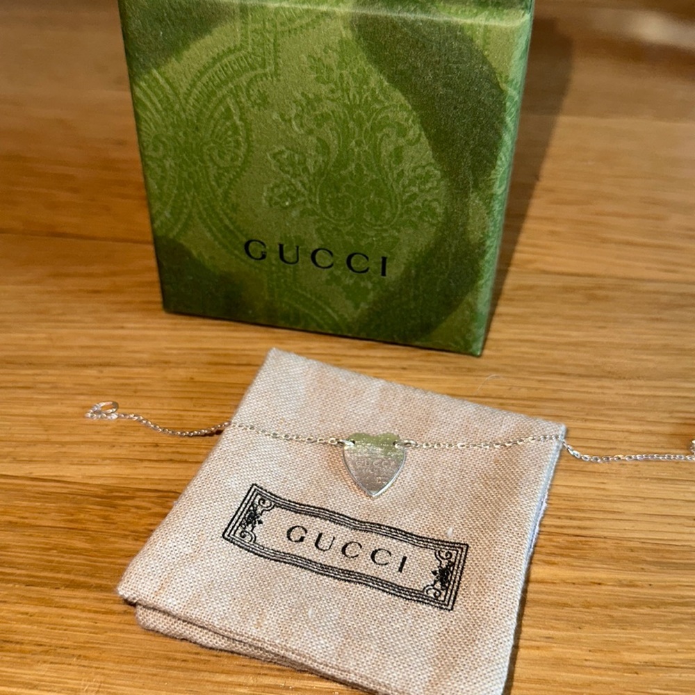 GUCCI TRADEMARK BRACELET WITH HEART PENDANT